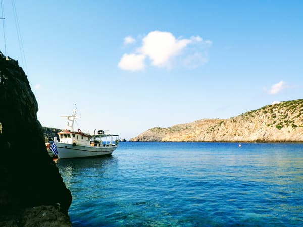 A small ferry in the rocky cove of Bouka on Antikythira