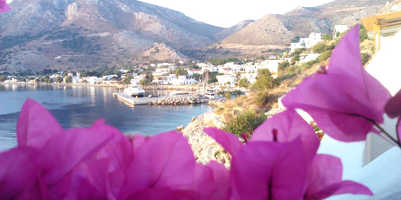 Bougainvillea framing the bay of Livadia on Tilos